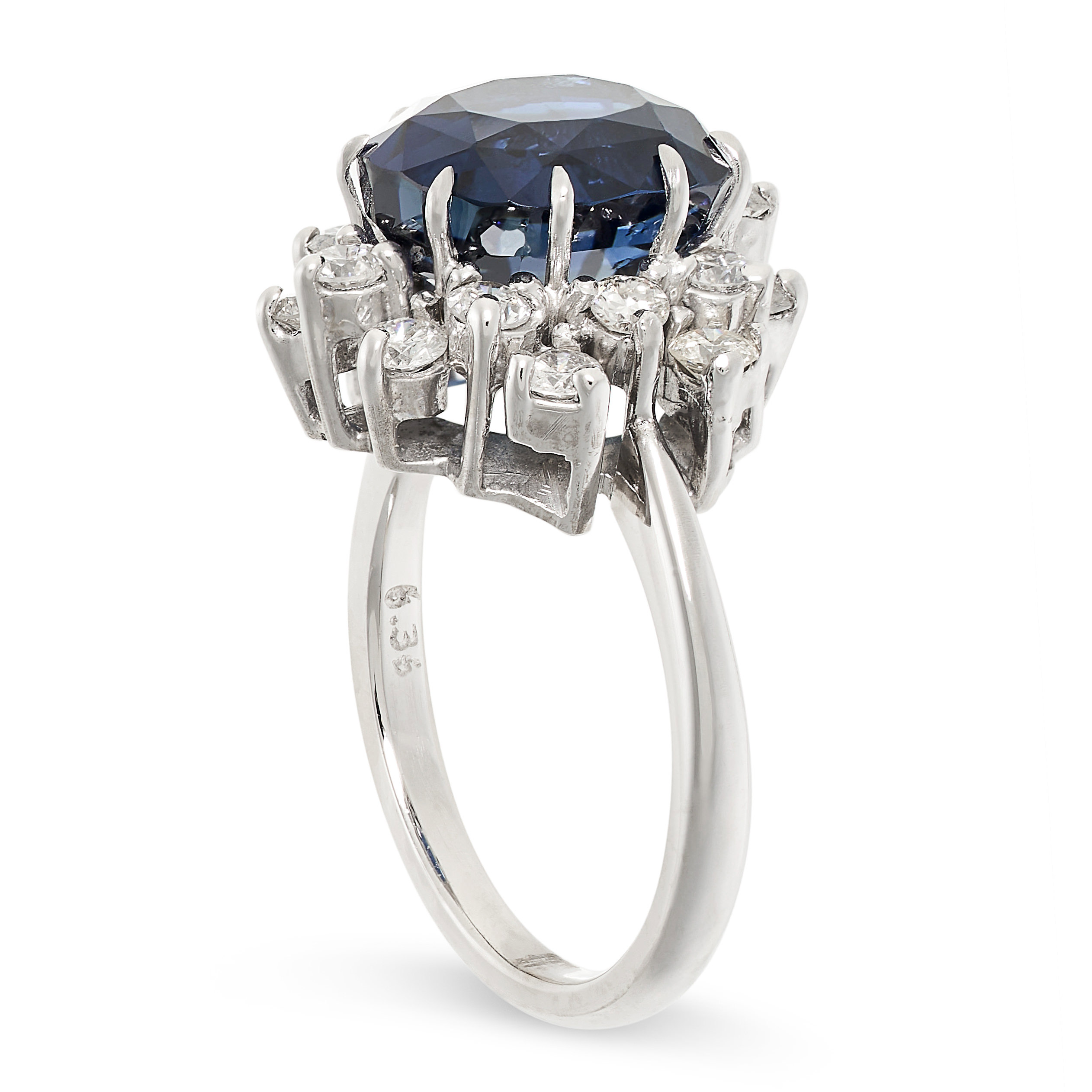 A SAPPHIRE AND DIAMOND CLUSTER RING set with a cushion cut sapphire of 6.36 carats within a border - Image 2 of 2