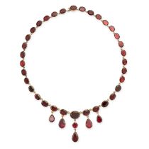 AN ANTIQUE GARNET RIVIERE NECKLACE, 19TH CENTURY in yellow gold, comprising a single row of
