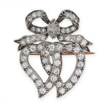 AN ANTIQUE DIAMOND SWEETHEART BROOCH in yellow gold and silver, designed as two interlocking witches