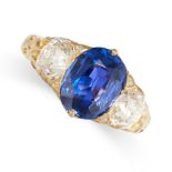 A SAPPHIRE AND DIAMOND THREE STONE RING in yellow gold, set with a cushion cut blue sapphire of 3.02