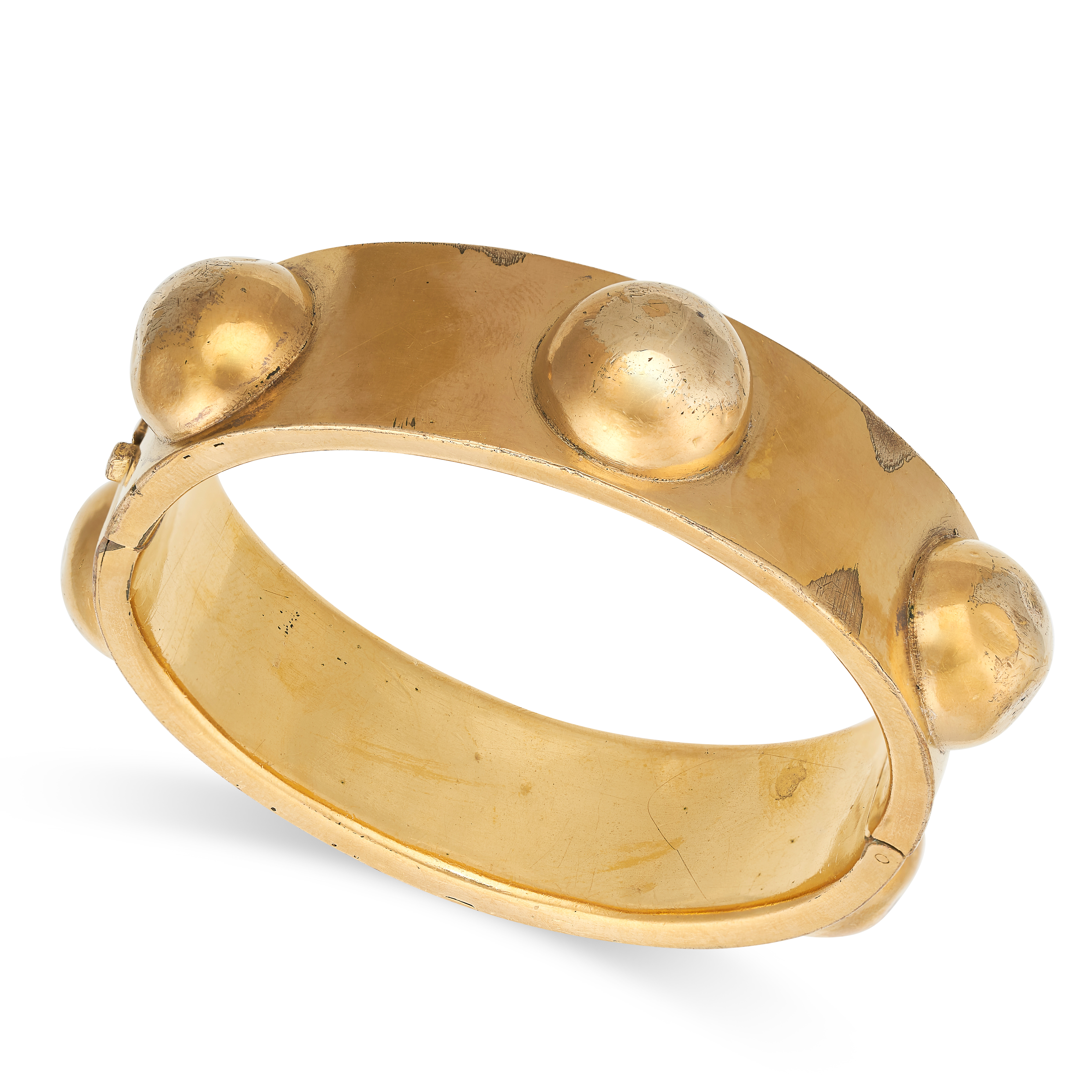 AN ANTIQUE BANGLE the hinged body with domed decoration, no assay marks, inner circumference 16.5cm,