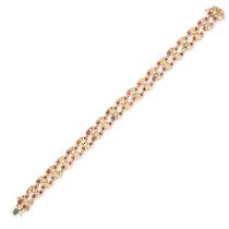 A RUBY AND DIAMOND BRACELET in 18ct yellow gold, omprising two rows of tear shaped links set with