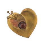 A PAIR OF BROOCHES comprising a base metal, heart shaped brooch set with a brown cabochon stone over