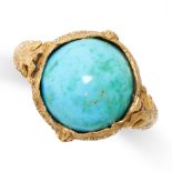 A TURQUOISE RING set with a round cabochon turquoise on an ornate engraved band, no assay marks,