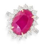 A RUBY AND DIAMOND RING set with an oval cut ruby of 6.97 carats in a cluster of round brilliant cut