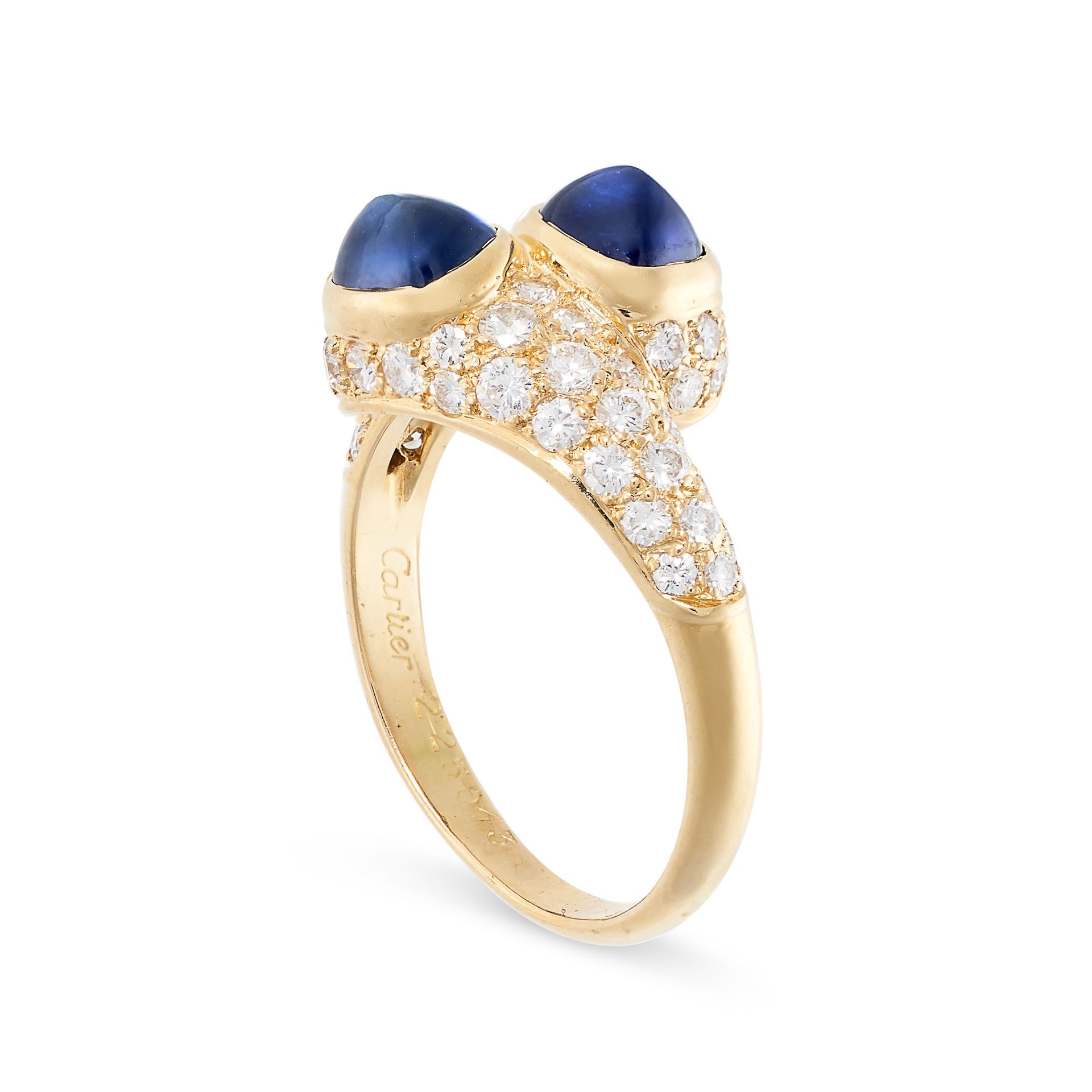 CARTIER, A SAPPHIRE AND DIAMOND CROSSOVER RING in 18ct yellow gold, set with two cabochon - Bild 2 aus 2