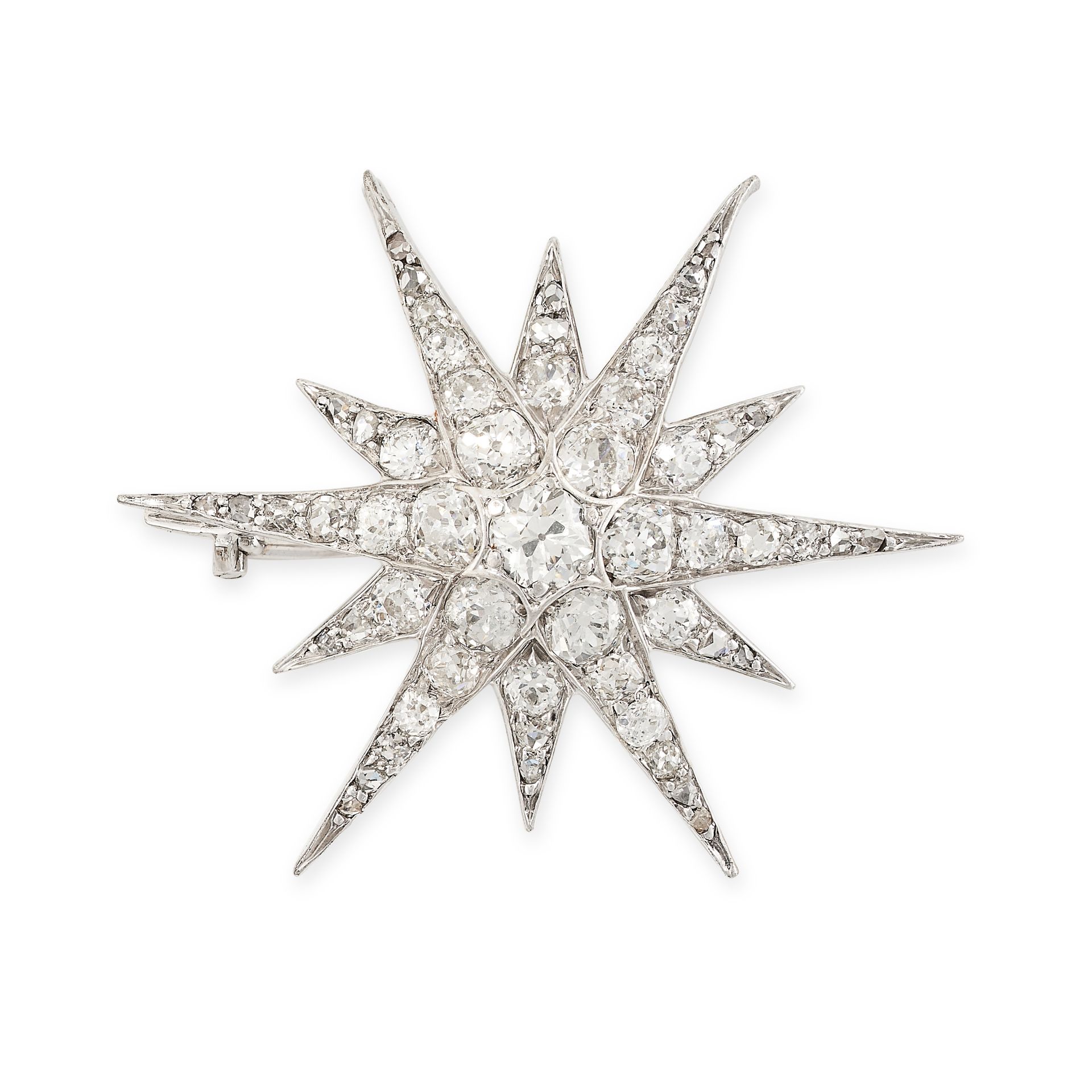 A DIAMOND STAR BROOCH in white gold, designed as a twelve rayed star, set throughout with old cut