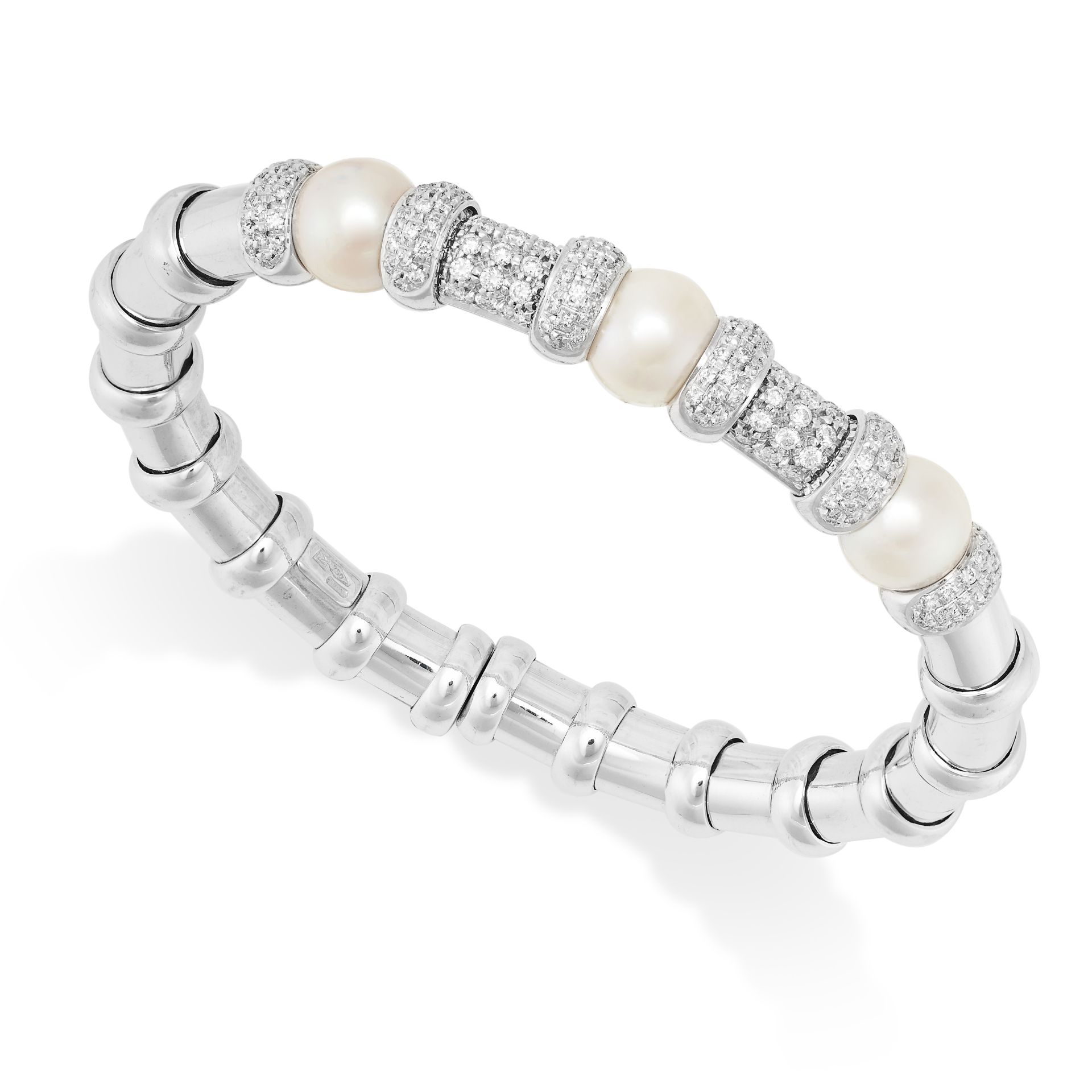 A PEARL AND DIAMOND BANGLE in 18ct white gold, the flexible bracelet part set with round cut