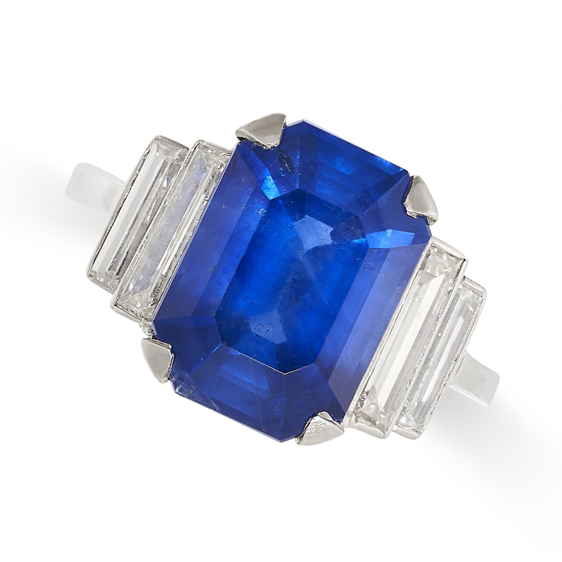 A FINE ART DECO SAPPHIRE AND DIAMOND RING in platinum, set with an emerald cut sapphire of 5.88