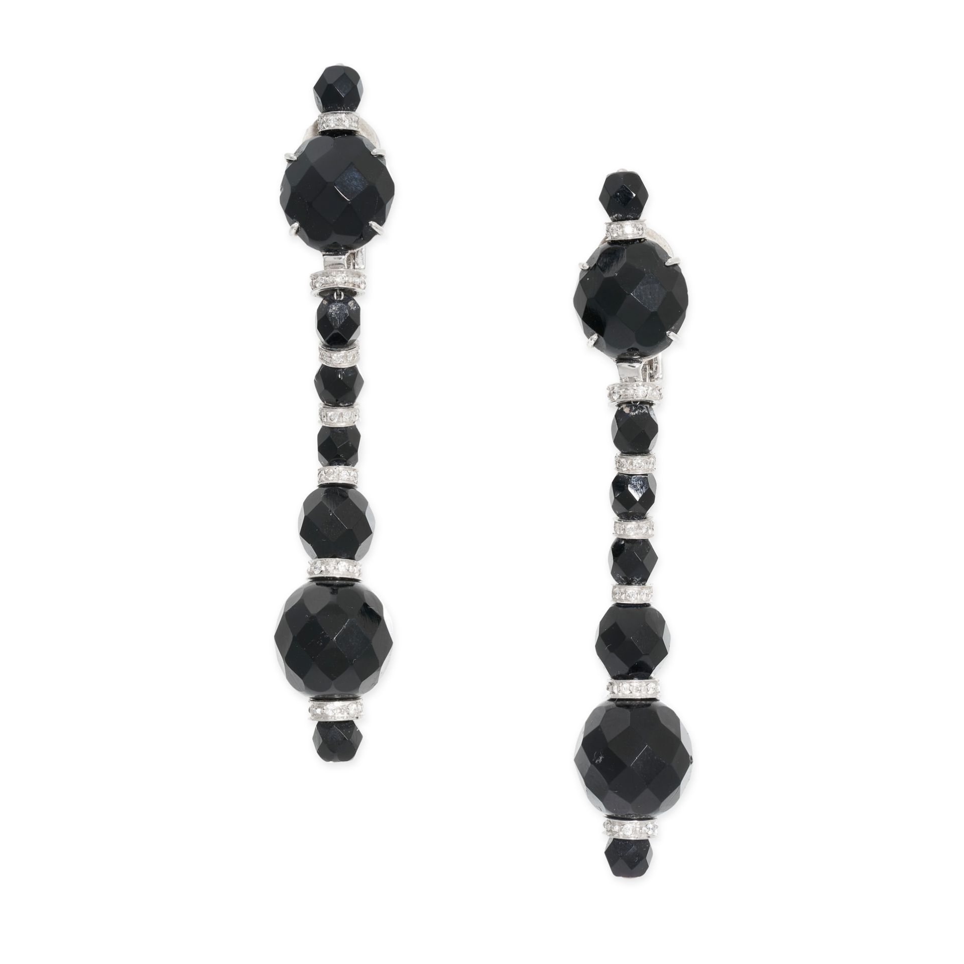 A PAIR OF ONYX AND DIAMOND CLIP EARRINGS in drop design, each comprising a row of alternating