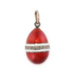 IVAN BRITZIN, AN ANTIQUE RUSSIAN IMPERIAL EGG PENDANT in 56 zolotnik gold and silver, the ovoid