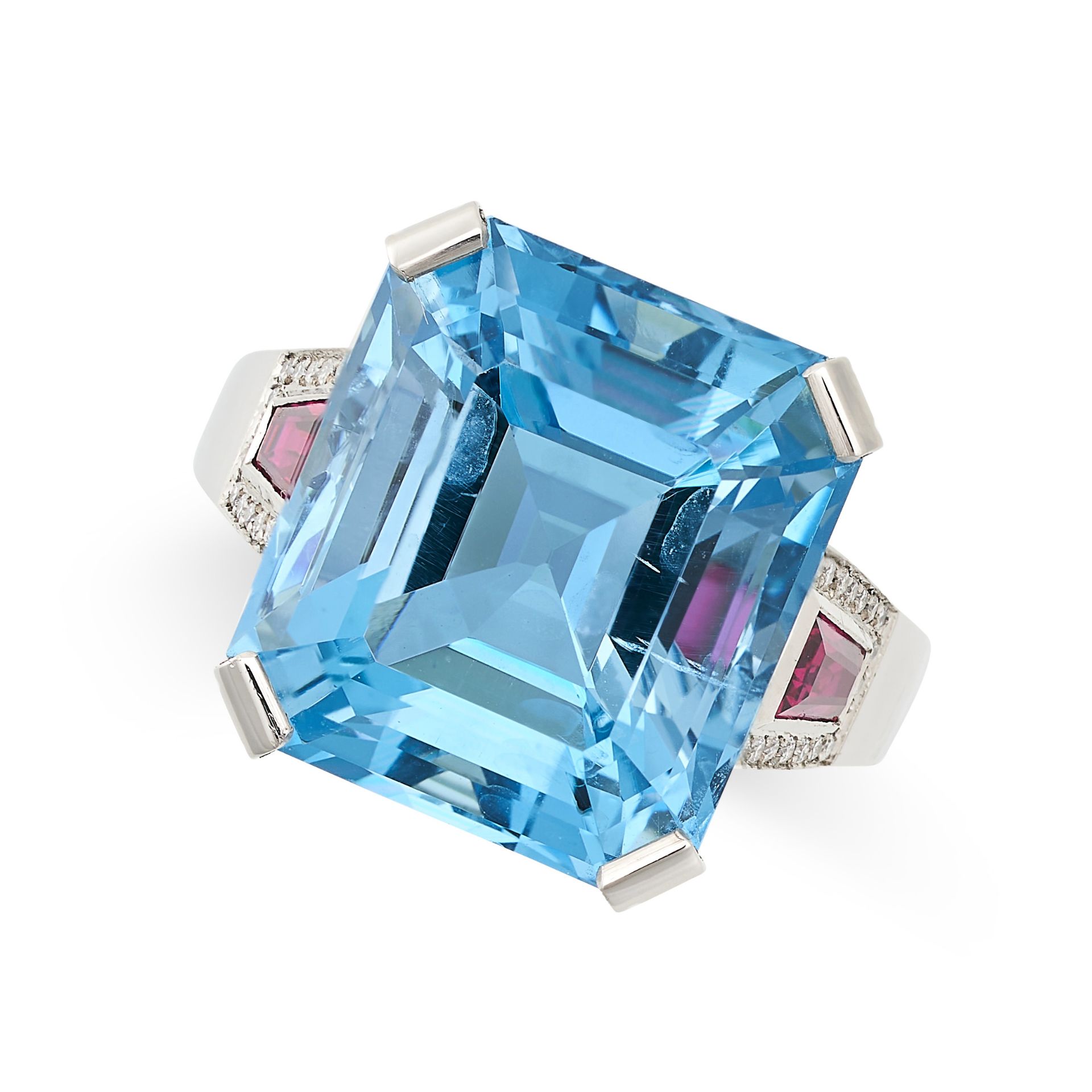 AN AQUAMARINE, RUBY AND DIAMOND COCKTAIL RING in platinum, set with an emerald cut aquamarine of