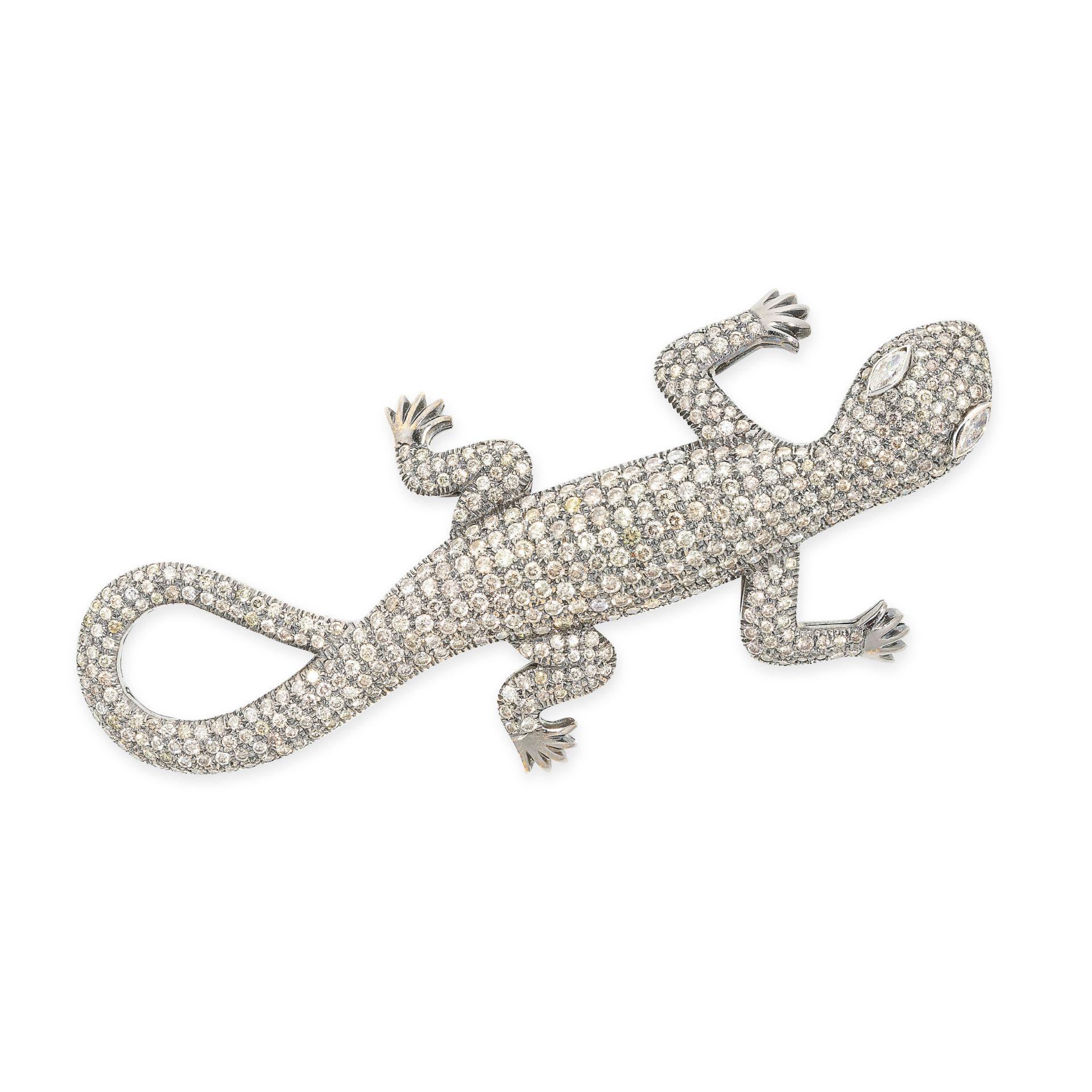 A DIAMOND LIZARD BROOCH in blackened gold, designed as a lizard, the eyes set with marquise cut