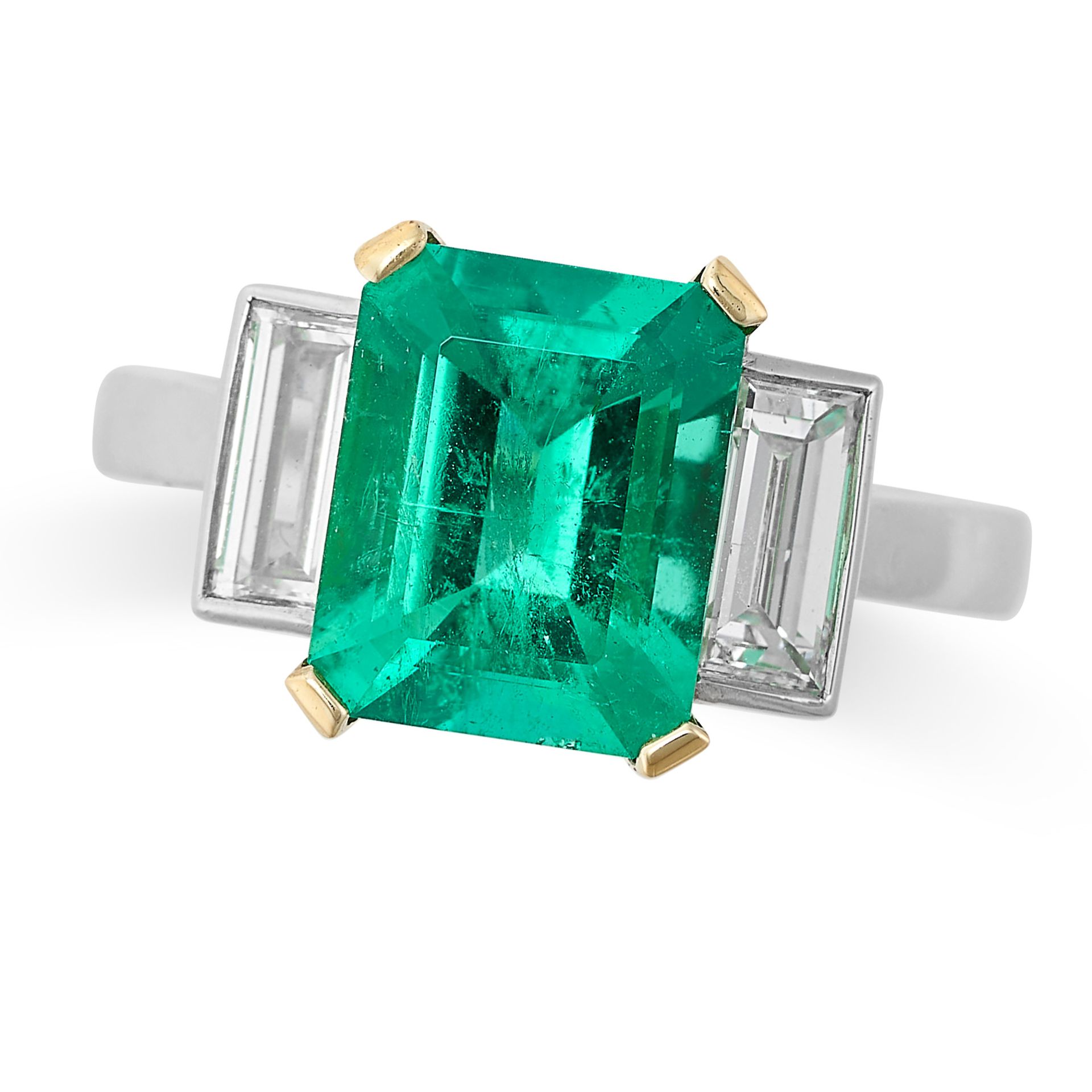 A COLOMBIAN EMERALD AND DIAMOND RING in 18ct yellow gold and platinum, set with an octagonal cut