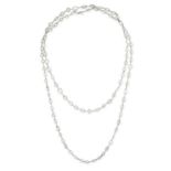 A DIAMOND SAUTOIR NECKLACE in platinum, set with a row of marquise, pear, trillion, oval, emerald,