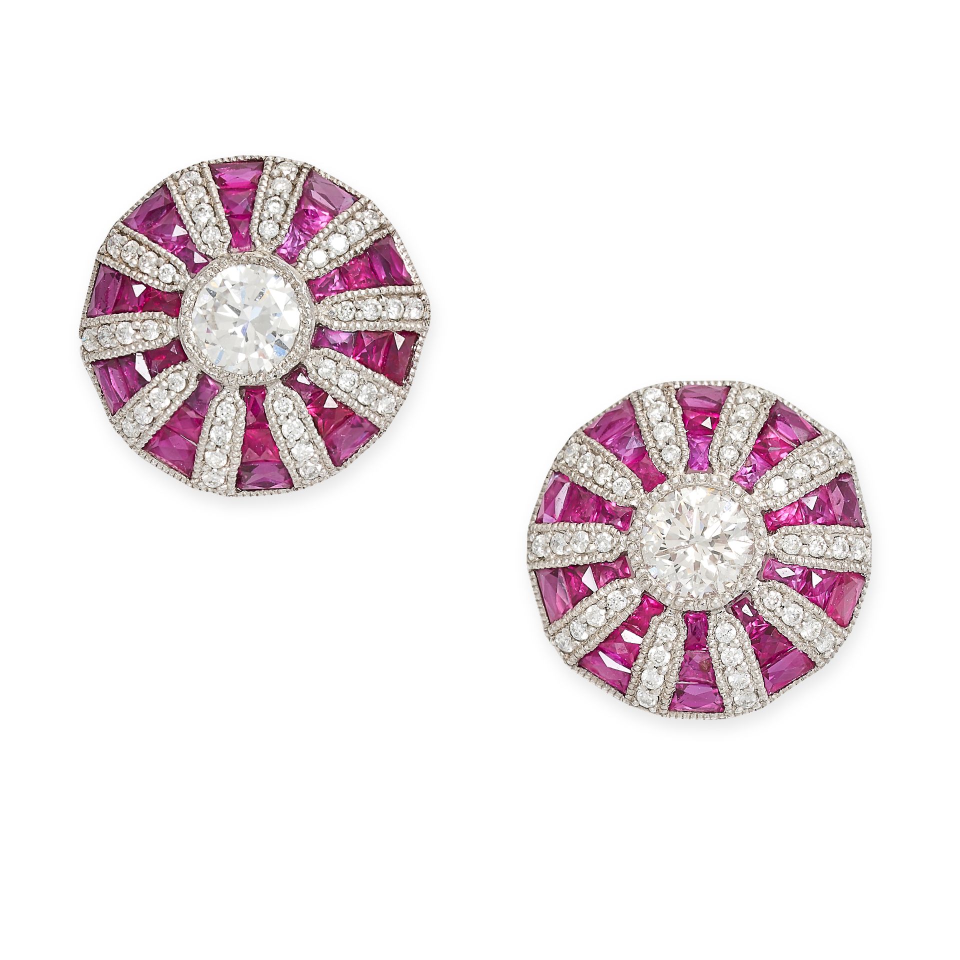 A PAIR OF RUBY AND DIAMOND STUD EARRINGS in platinum, the circular faces each set with a central