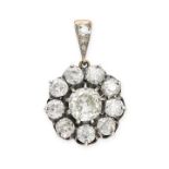 AN ANTIQUE DIAMOND PENDANT in yellow gold and silver, set with an old cut diamond of 1.70 carats