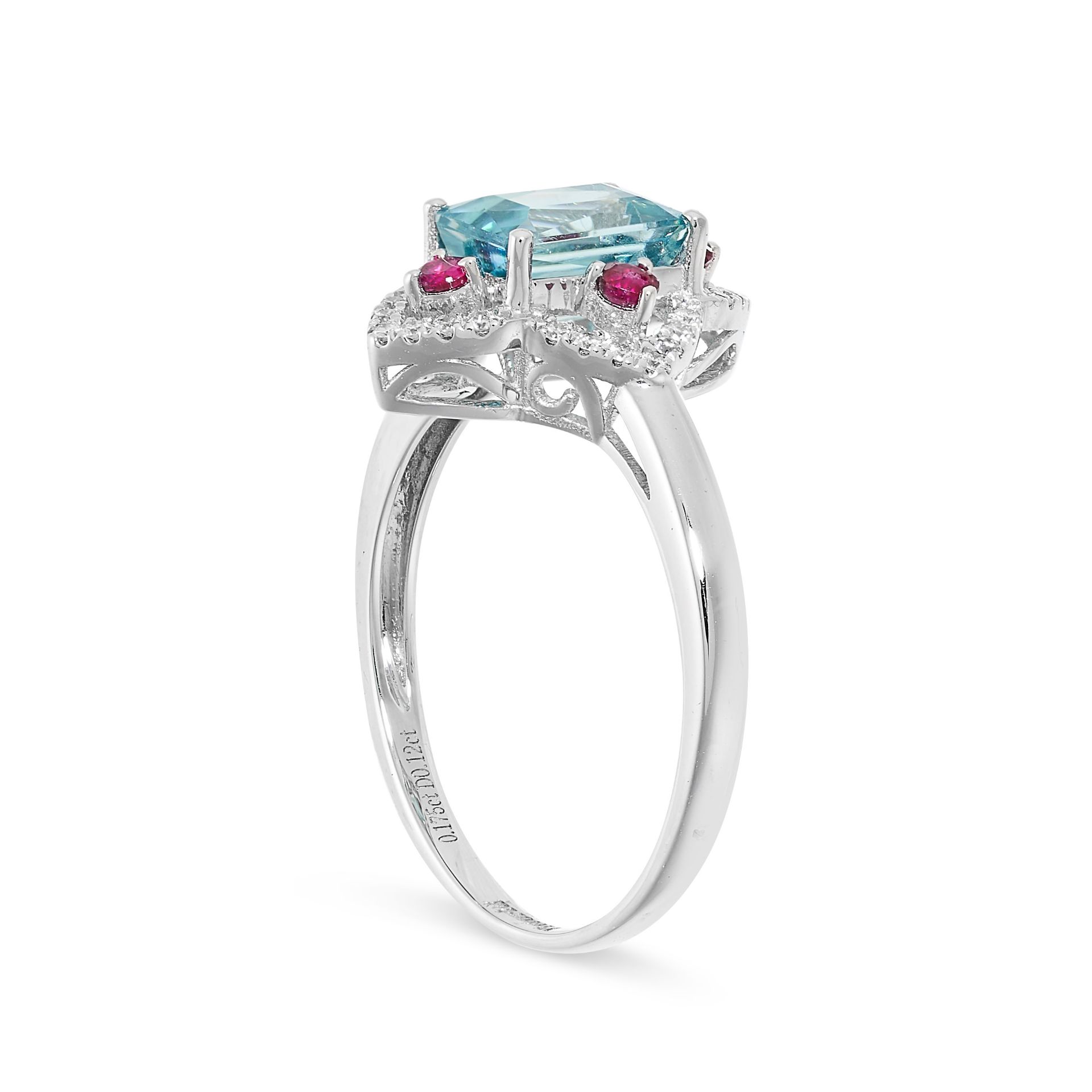 A BLUE ZIRCON, RUBY AND DIAMOND RING in 14ct white gold, set with a central mixed cut zircon of 1.89 - Bild 2 aus 2