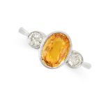 A YELLOW SAPPHIRE AND DIAMOND RING set with an oval cut yellow sapphire of 2.00 carats, between