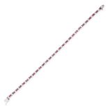 A RUBY AND DIAMOND LINE BRACELET in platinum, set with a row of alternating round cut rubies and