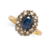 NO RESERVE - A SAPPHIRE AND DIAMOND CLUSTER RING in 18ct gold, set with an oval sapphire in a