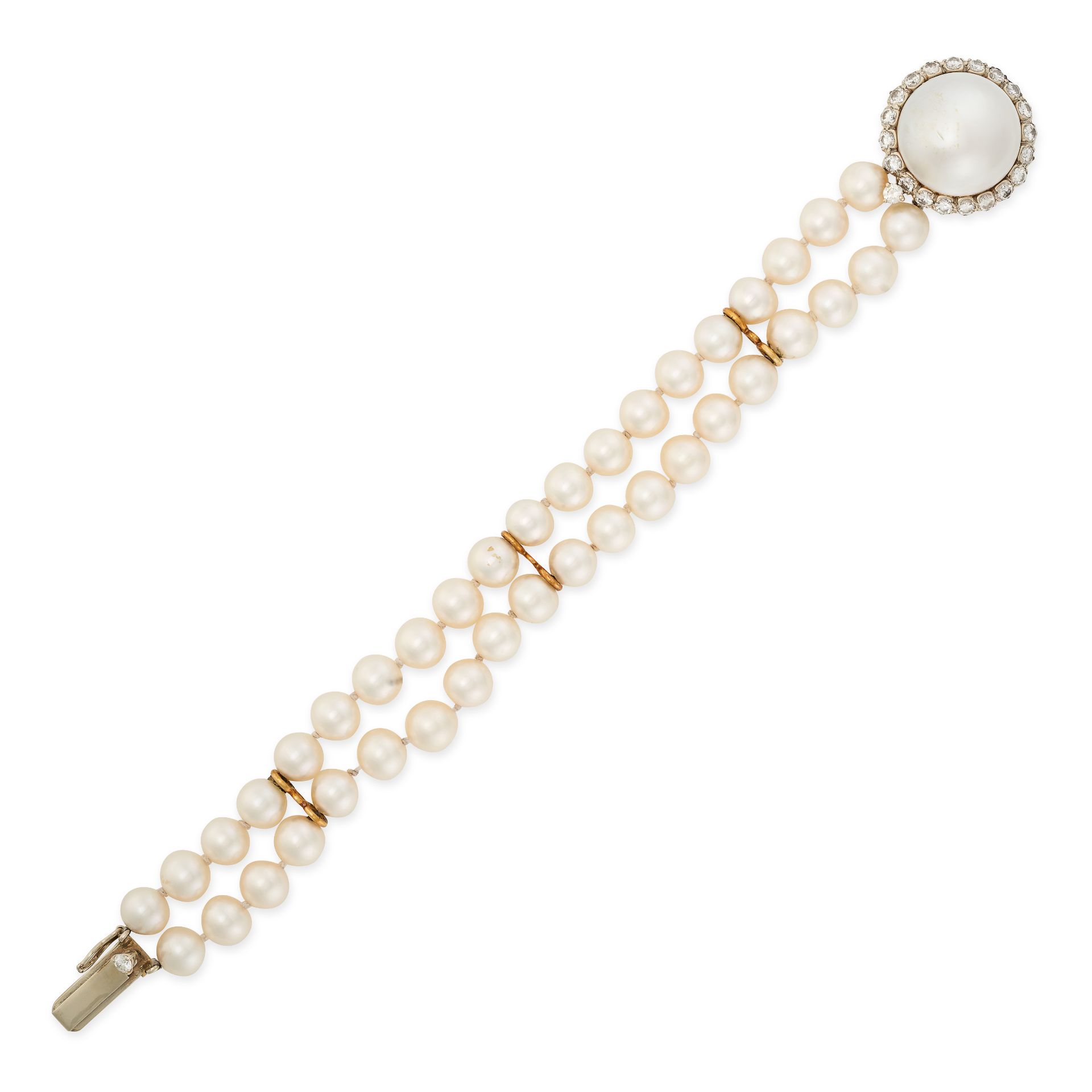 A PEARL AND DIAMOND BRACELET comprising two rows of pearls, the clasp set with a mabe pearl of 18.