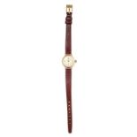 A VINTAGE LADIES WRIST WATCH the circular cream dial with Roman numerals, with brown leather