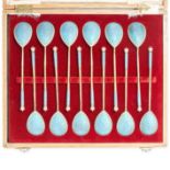 A SET OF TWELVE ANTIQUE IMPERIAL RUSSIAN SILVER ENAMEL TEA SPOONS, VASILY ANDREEV, MOSCOW 1899-
