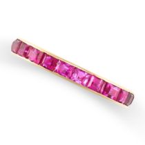 A RUBY ETERNITY RING in yellow gold, channel set in yellow gold with step cut rubies totalling 2.
