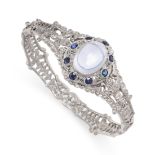 A MOONSTONE, SYNTHETIC SAPPHIRE AND MARCASITE BANGLE set with a cabochon moonstone in a cluster of