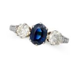 A VINTAGE SAPPHIRE AND DIAMOND THREE STONE RING set with an oval cut sapphire of 0.94 carats between