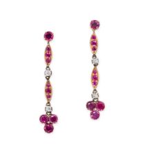 A PAIR OF RUBY AND DIAMOND DROP EARRINGS in yellow gold, each set with a round cut ruby suspending