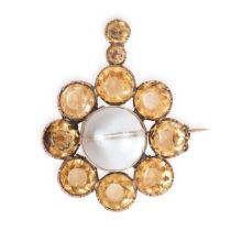 AN ANTIQUE TOPAZ AND ROCK CRYSTAL BROOCH / PENDANT in yellow gold, set with a hinged polished rock