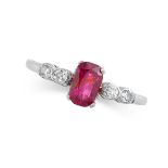 A RUBY AND DIAMOND RING set with a cushion cut ruby of 0.90 carats, between pairs of old cut