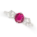 A RUBY AND DIAMOND THREE STONE RING in 18ct white gold and platinum, set with a round cut ruby of