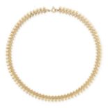 AN ANTIQUE FANCY LINK NECKLACE in yellow gold, comprising a row of fancy links accented by beaded