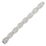 AN ART DECO DIAMOND BRACELET the articulated geometric links set with old and single cut diamonds,