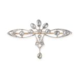 A DIAMOND BROOCH, EARLY 20TH CENTURY in 14ct yellow gold and platinum, the scrolling body set with a