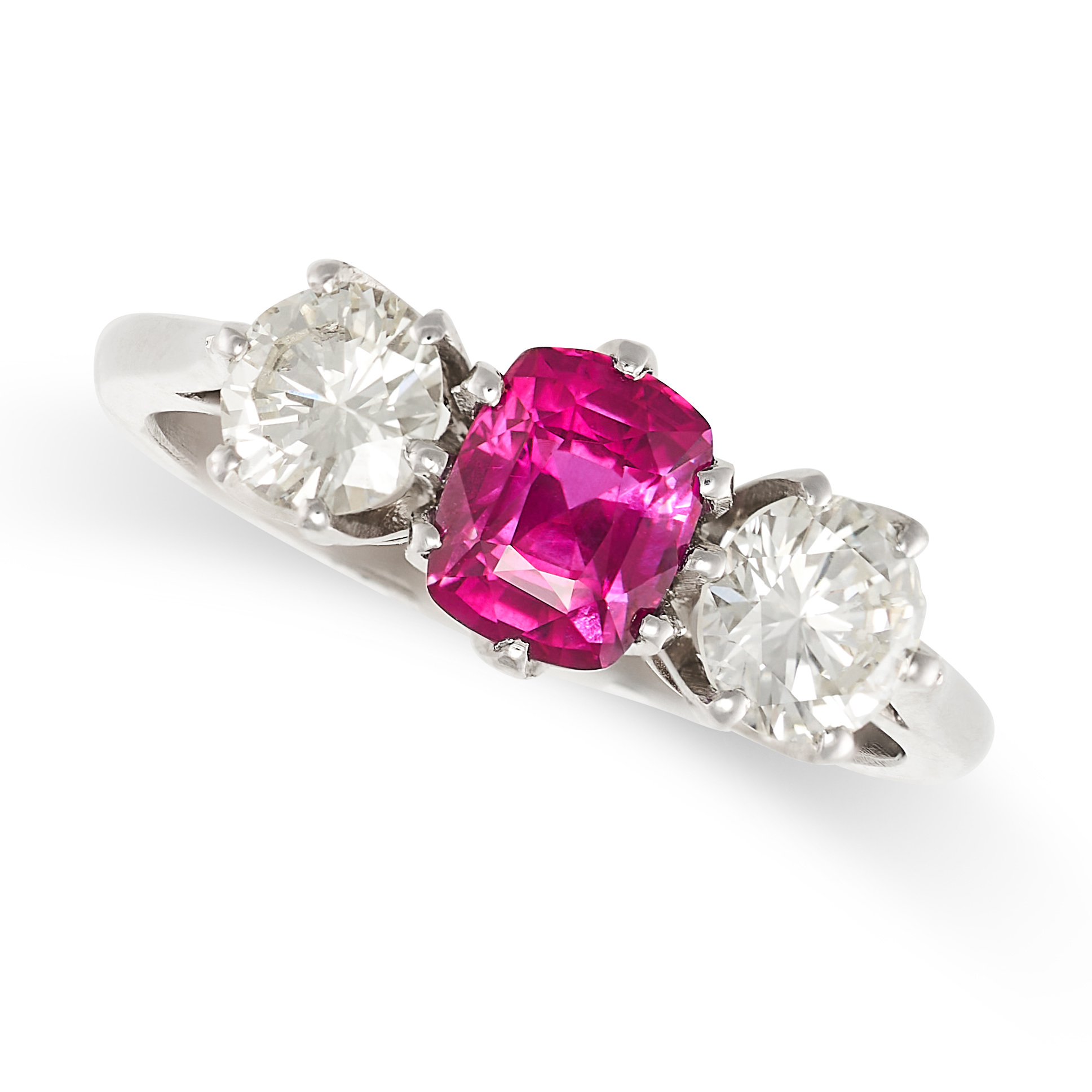 A FINE UNHEATED RUBY AND DIAMOND THREE STONE RING in 18ct white gold, set with a cushion cut ruby of