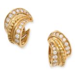 A PAIR OF DIAMOND CLIP EARRINGS in yellow gold, each designed as a stylised hoop, accented by two