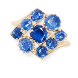 A VINTAGE SAPPHIRE RING in yellow gold, the panel face set with three rows of round and cushion