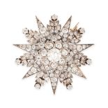A FINE ANTIQUE DIAMOND STAR BROOCH / PENDANT in yellow gold and silver, designed as a seven rayed