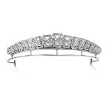 A DIAMOND BANDEAU TIARA in geometric ribbon design, set with round and single cut diamonds, no assay