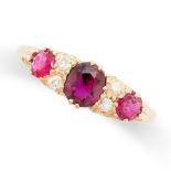 AN ANTIQUE RUBY AND DIAMOND RING in 18ct yellow gold, set with a cushion and two round cut rubies