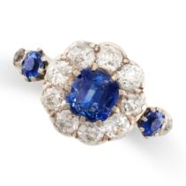 A SAPPHIRE AND DIAMOND RING in 18ct yellow gold and silver, set with a central cushion cut