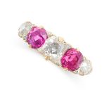 AN ANTIQUE RUBY AND DIAMOND RING in yellow gold, set with two cushion cut rubies and three old cut