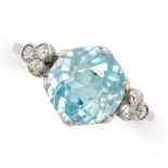 A BLUE ZIRCON AND DIAMOND RING set with a round cut blue zircon of 3.73 carats accented by trios