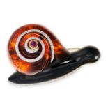 A VINTAGE AMBER, RUBY AND DIAMOND SNAIL BROOCH in 18ct yellow gold and white gold, the body formed