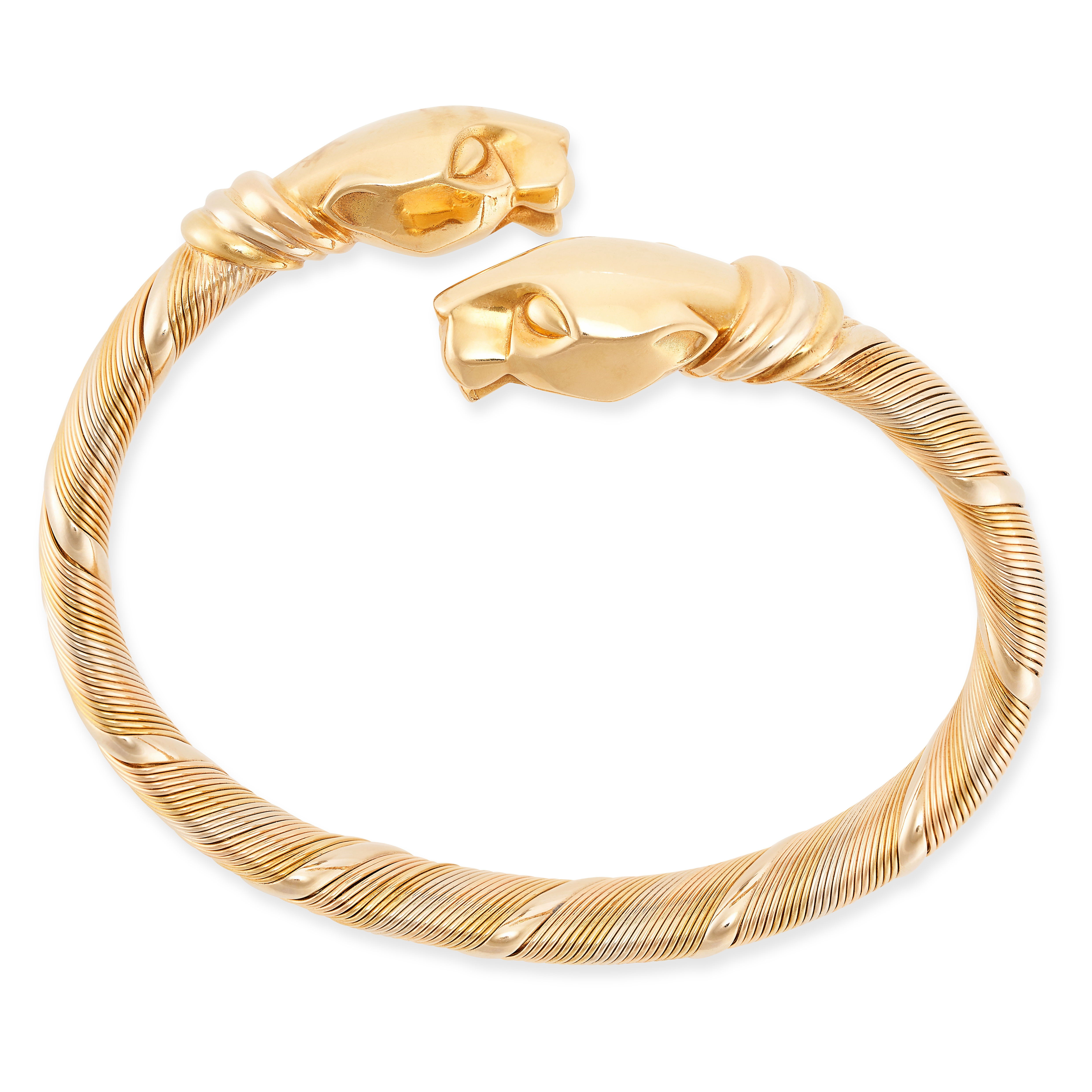 CARTIER, A VINTAGE PANTHERE DE CARTIER BANGLE in 18ct yellow, white and rose gold, the flexible body