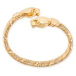 CARTIER, A VINTAGE PANTHERE DE CARTIER BANGLE in 18ct yellow, white and rose gold, the flexible body